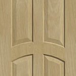 Four vertical raised panels double arched top interior door